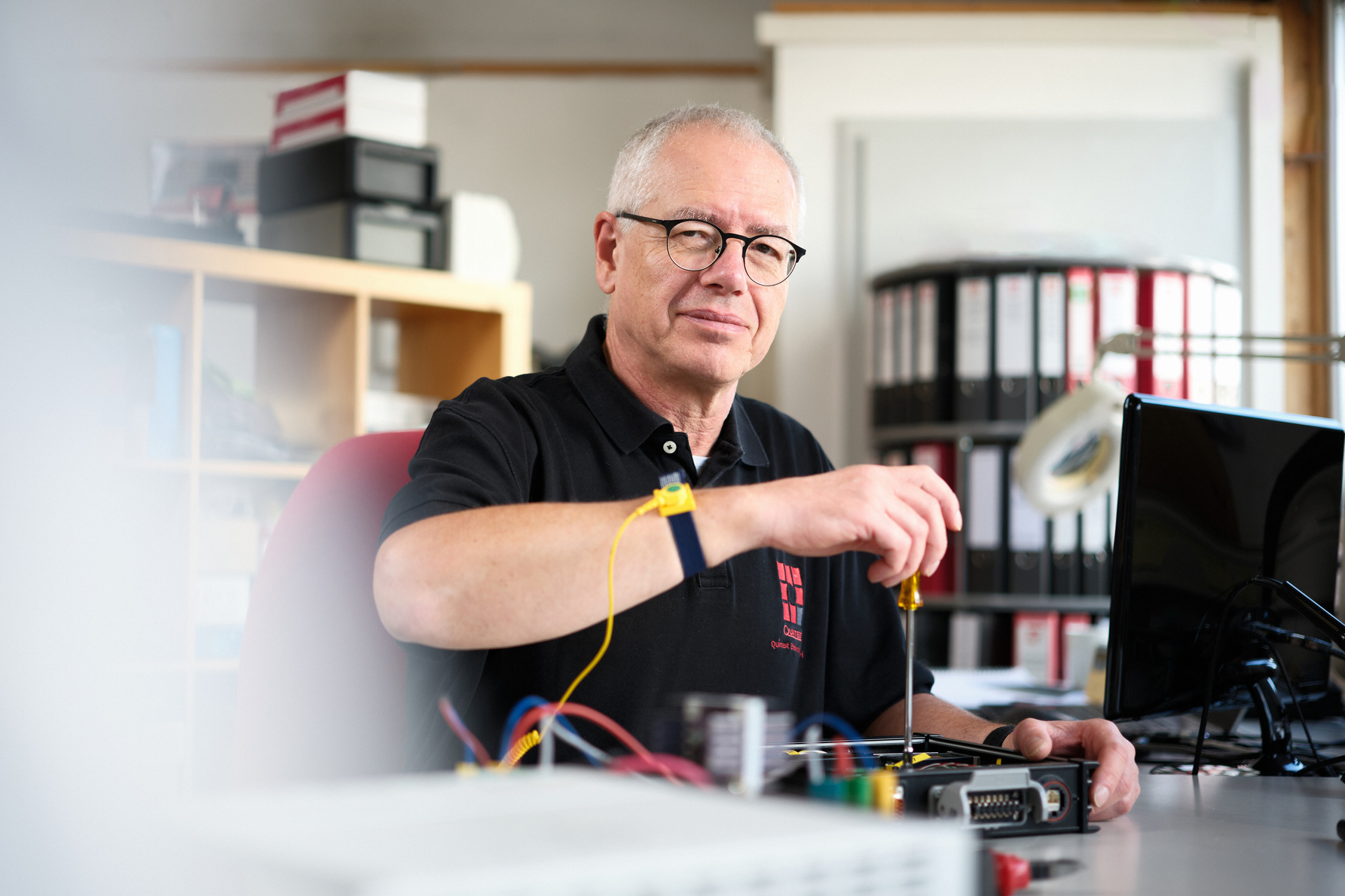 The hero image shows one of our custom industrial equipment experts working on an industrial device