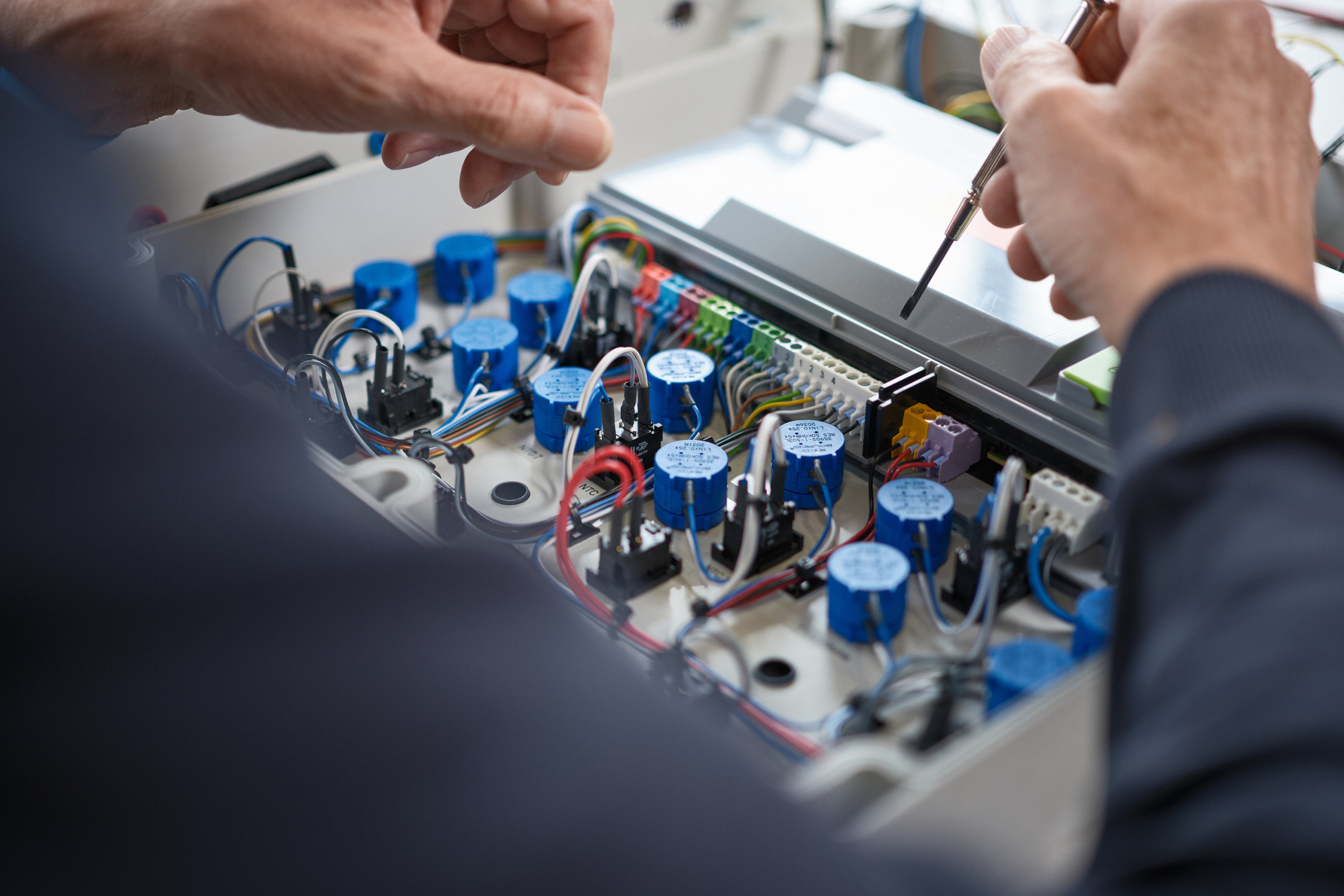 The hero image for industrial machine solutions shows one of our machine design engineers working on special-purpose machines
